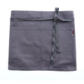 Gray waist apron with pockets on a white background